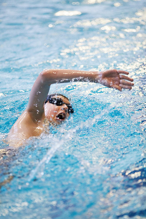 photo of a young swimming pupil doing the crawl